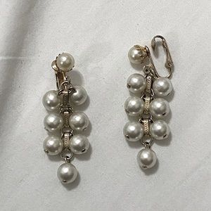 Costume jewelry pearl clip on earrings.